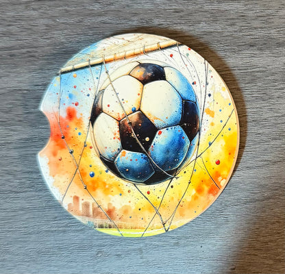 Soccer Sporting Ceramic car coasters, designed to fit most cup holders, are absorbent and help keep cars clean. They feature a vibrant design and are a great gift for car lovers.