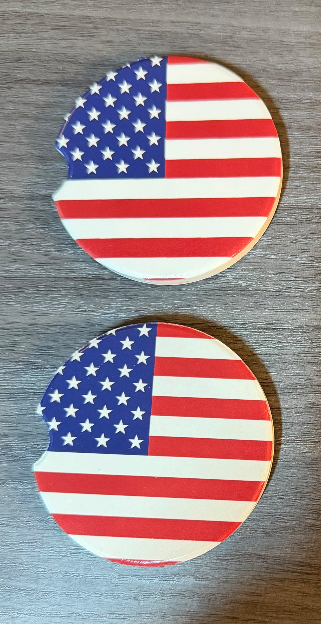 USA Flag Ceramic car coasters, designed to fit most cup holders, are absorbent and help keep cars clean. They feature a vibrant design and are a great gift for car lovers.