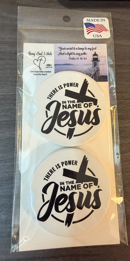 "In The Name Of Jesus" Ceramic car coasters, designed to fit most cup holders, are absorbent and help keep cars clean. They feature a vibrant design and are a great gift for car lovers.