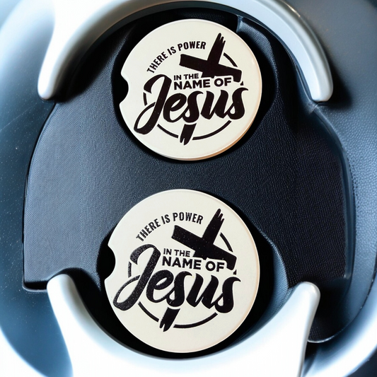 "In The Name Of Jesus" Ceramic car coasters, designed to fit most cup holders, are absorbent and help keep cars clean. They feature a vibrant design and are a great gift for car lovers.